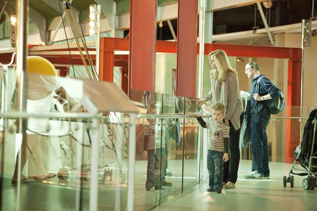 A child looking at an exhibit inside the Maritime Museum