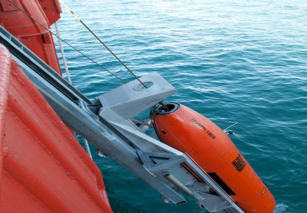 Remotely Operated Vehicles being lifted onto a boat