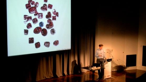 In the pink: The story of diamonds in Western Australia - Peter Downes presenting a talk with an image of diamonds on the presentation screen