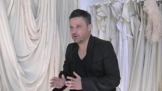 Career Highlights - Aurelio Costarella being filmed in front of white dresses