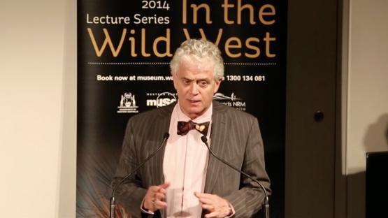 Dr Ian D. MacLeod - In the Wild West - Dr Ian D. MacLeod standing at a lectern giving a presentation