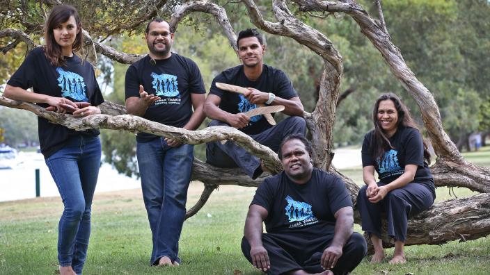 Yirra Yaakin performers The Yirra Yakkin cast posing near a tree branch