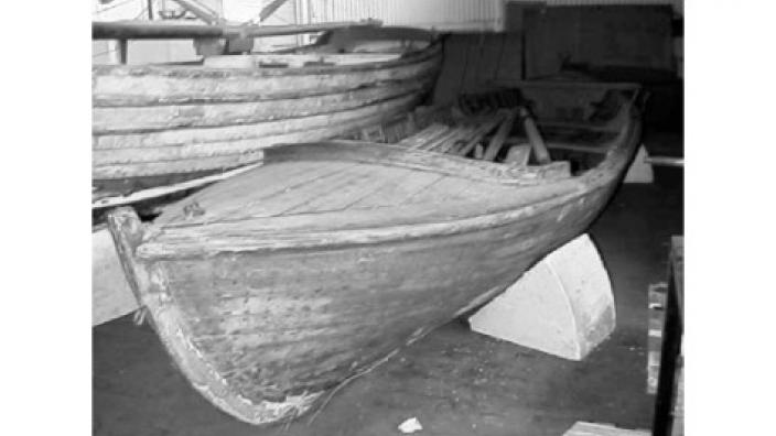 H.T. Denny banana surfboat - Image copyright of WA Museum A banana surfboat resting in someone's backyard