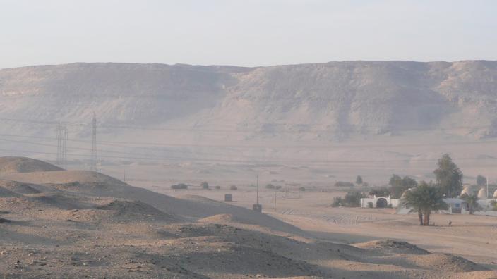 A landscape of an expansive Saharan desert