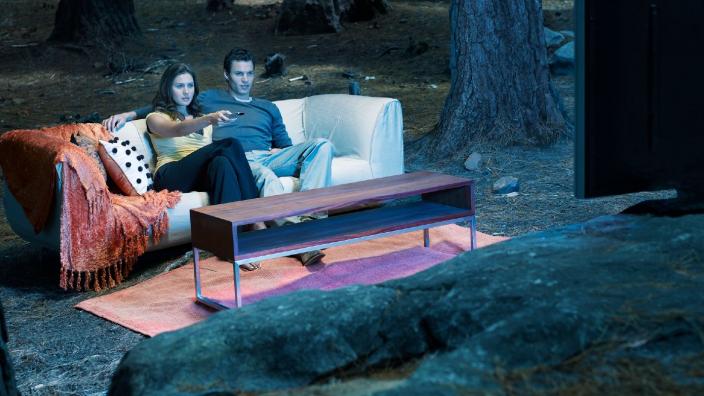 SCINEMA at the Museum of the Great Southern "A couple are sat on a couch in the middle of the forest watching TV."