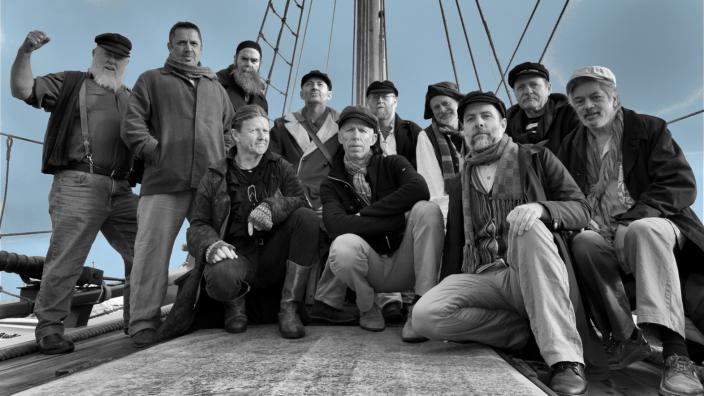 Caption: Songs of the Sea "The Lost Quays taking a group photo."