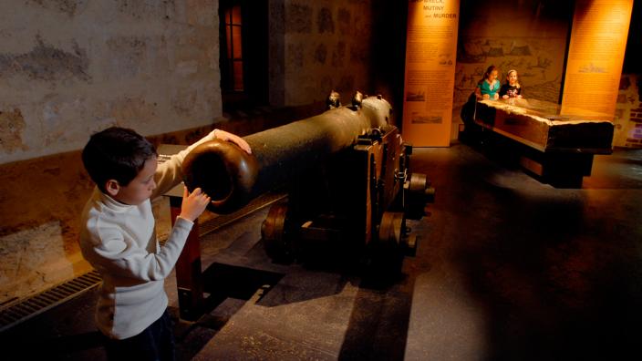 Cannon - Image copyright of the Western Australian Museum A child looking into a cannon which has been recovered from a shipwreck