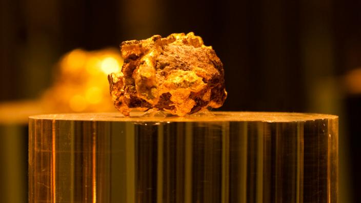 A gold nugget - Image copyright of the Western Australian Museum A large gold nugget on a podium