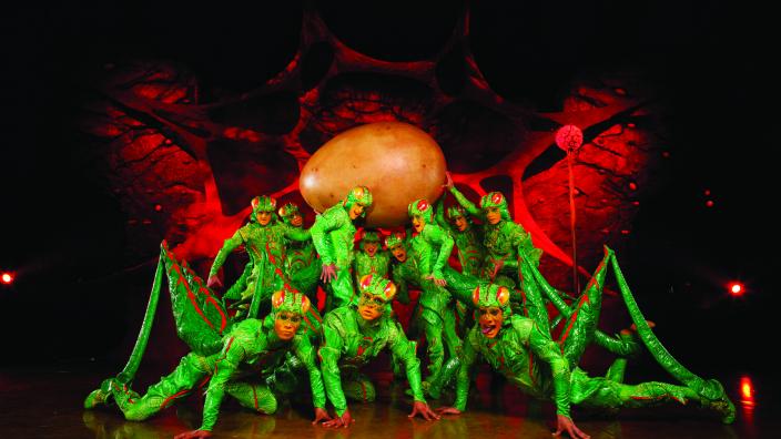 Circus performers dressed as crickets