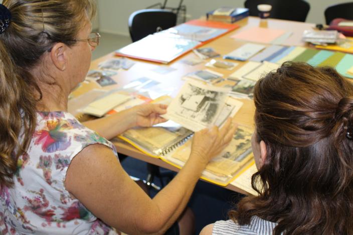 Exmouth resident shows WA Museum staff member a newspaper clipping