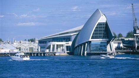 Maritime Museum photographed from the river with two small vessels