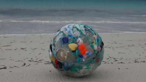 Plastic Waste - Image courtesy of Tim Pearn Plastic waste collected and rolled into a large ball on the beach