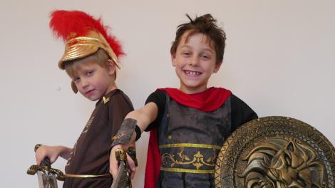 Caption: Rome Revival! "Two children dressed as Roman soldiers, ready for battle."