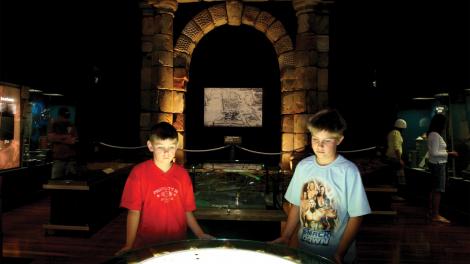 Batavia - Image copyright of the Western Australian Museum Two children gathered around a display in the Batavia exhibition