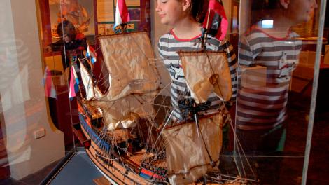Replica Duyfken - Image copyright of the Western Australian Museum A model ship behind a glass cabient