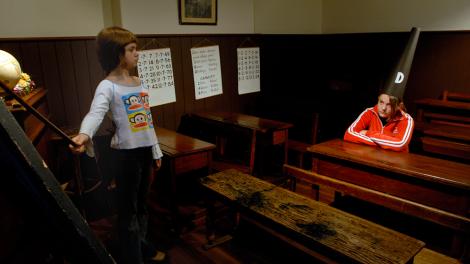 Old One Teacher School Room - Image copyright of the Western Australian Museum A child pretending to be a teacher to another child wearing a dunce hat