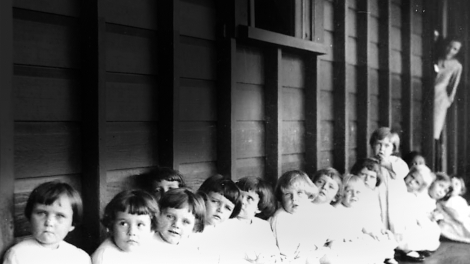 Small children waiting to be immunised at Nudgee Orphanage, Brisbane, about 1928 - John Oxley Library, State Library of Queensland