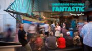 People inside the WA Maritime Museum looking at the historic boats 