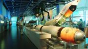 Caption: A view of the Naval Defence gallery. - Image copyright Western Australian Museum "A long shot of the Naval Defence gallery. In the foreground are large missiles used during wartime."
