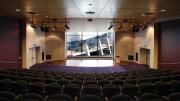 Maritime Museum NWS Shipping Theatre Rows of seats facing floor to ceiling glass windows at the front of theatre which overlook the harbour