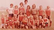 A boys football team pose for a team photo, circa 1970s