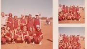 A young women's football team pose with their coach for a team photo, circa 1970s