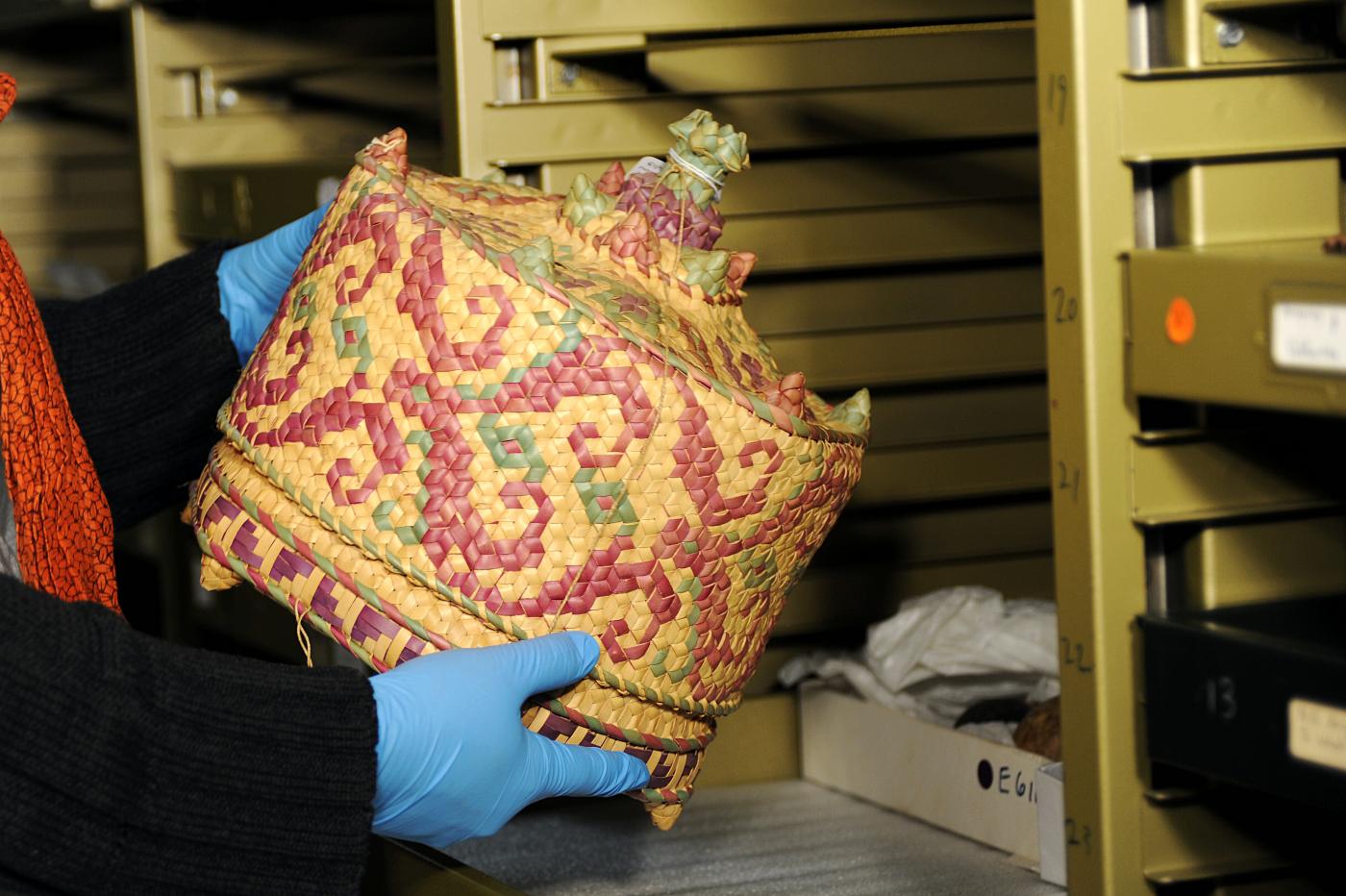 Annie inspecting one of the Coluquhon collection Timorese Temple Baskets.