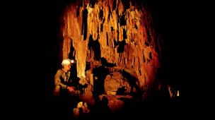 Caver Paul Devine in fossil cave