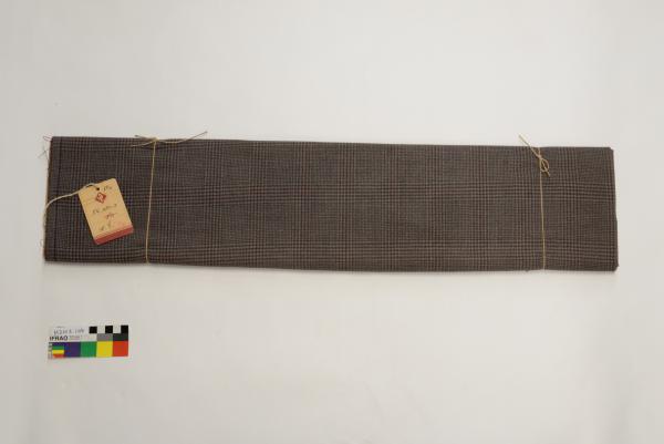 BOLT OF FABRIC, wool, brown tartan pattern, manufacturer's swing tag; 'PWLtd', tied with string