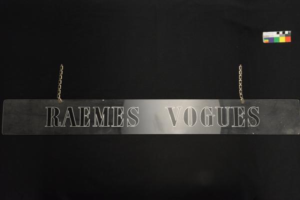 SHOP SIGN, 'RAEMES VOGUES' Perspex, long narrow rectangular shape, black with silver outline lettering.  Suspension chain attached on upper corners