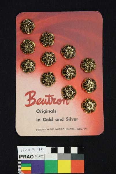 BUTTON SHEET, twelve gold buttons on crimson card, 'Beutron'