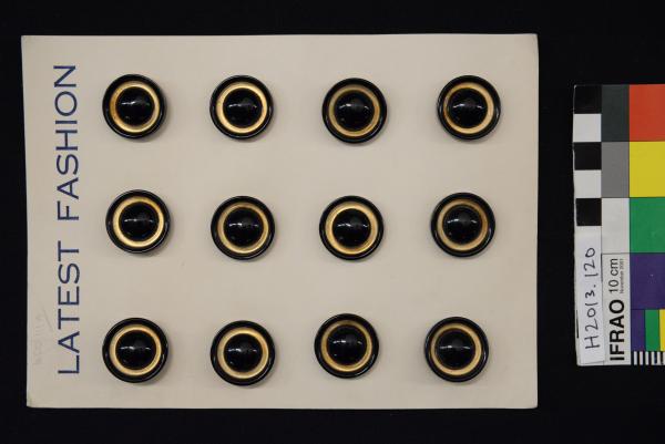 BUTTON SHEET, twelve black and gold plastic buttons on card 'LATEST FASHION'