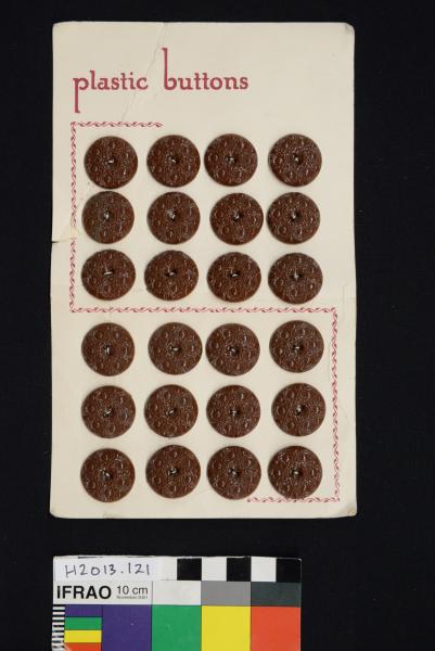 BUTTON SHEET, twenty four brown ornate plastic buttons on card 'LATEST FASHION'