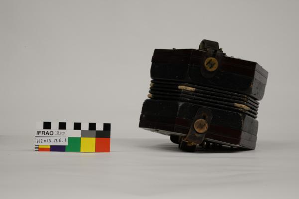 SQUEEZE BOX CONCERTINA, hexagonal, wood, EPNS and leather, hand-marked ‘W. HARWOOD/ CANNING VALE’, in black paper-covered box, c. 1920