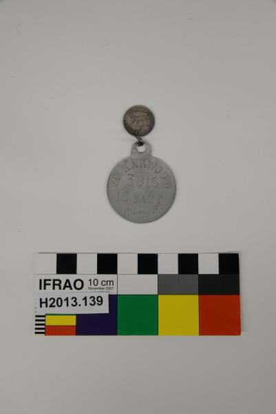 DOG TAG, AIF, WWI, ‘M. HARWOOD/ 3915./ 16. BATT./ A.I.F./ C.E.’, aluminium?, 1915-1916 Attached to ‘Lucky’ Australian threepence, 1911