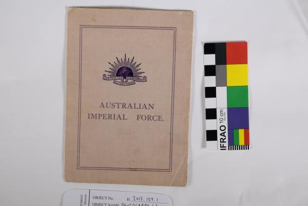 PHOTOGRAPH, b&w. Grave of William Harwood, 51st Battalion AIF with marked wooden cross at Passchendaele, Belgium. In ‘Australian Graves Services’ presentation folder and original envelope