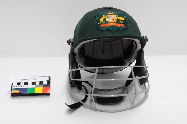 CRICKET HELMET, green fabric, detachable metal faceguard, chin strap, Australian coat of arms, Mike Hussey