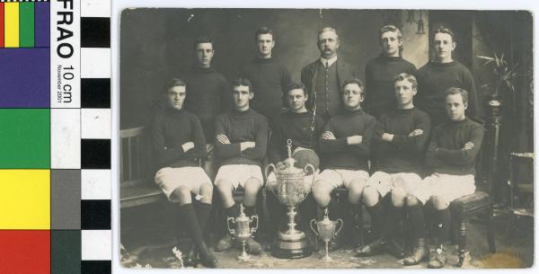 PHOTOGRAPH, Kodak postcard, b&w, Claremont Football (Soccer) Club with League, Charity & Challenge Cups, 1910 season