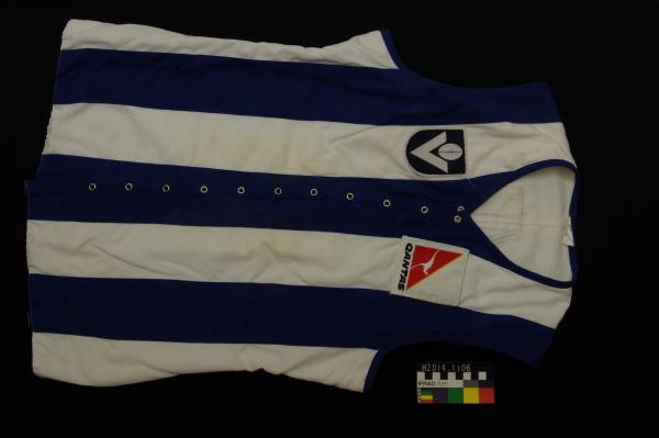 FOOTBALL JUMPER, V.F.L., North Melbourne, blue/white stripe, lace-up front, no. 4, Ross Glendinning, 1983