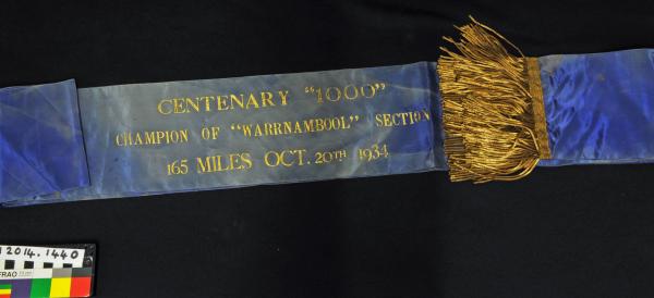 SASH, cycling, royal blue, gold fringe, 'CENTENARY 1000 CHAMPION OF WARNAMBOOL' 165 miles, 1934, H. MARSHALL