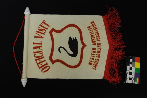 PENNANT, lawn bowls, white/red, black swan emblem, 'OFFICIAL VISIT WESTERN AUSTRALIAN LADIES BOWLING ASSOCIATION'