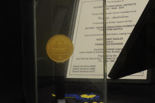 COMMEMORATIVE COIN IN SHOWCASE,  football, inaugural West Coast Eagles vs Fremantle Dockers, 14 May 1995
