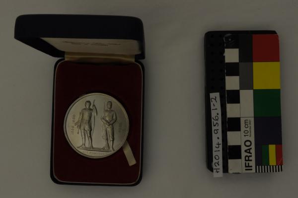 MEDAL, in box, blue vinyl, round, silver, ‘THE/ NATIONAL/ RIFLE ASSOCIATION/ 1860/ THE QUEEN’S PRIZE/ 1976 2nd STAGE’, ‘Fattorini & Sons Ltd./ MADE IN ENGLAND’