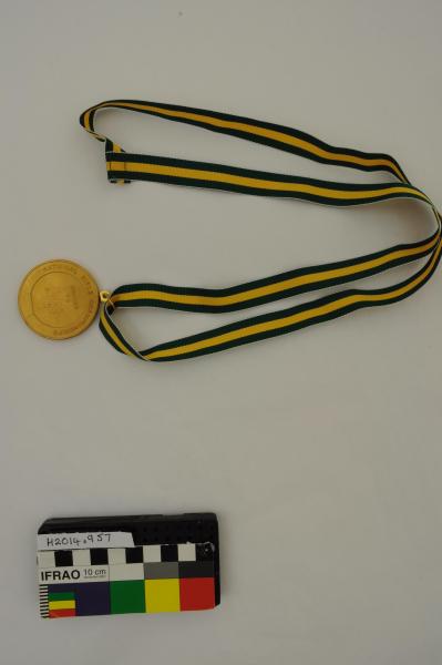 MEDAL, on green/yellow ribbon, round, gold, ‘NATIONAL/ RIFLE ASSOCIATION/ AUSTRALIA’, ‘NATIONAL RIFLE CHAMPIONSHIPS’, ‘AWARDED/ TO/ MATCH 4/ THE McINTOSH/ A GRADE/ 1983’