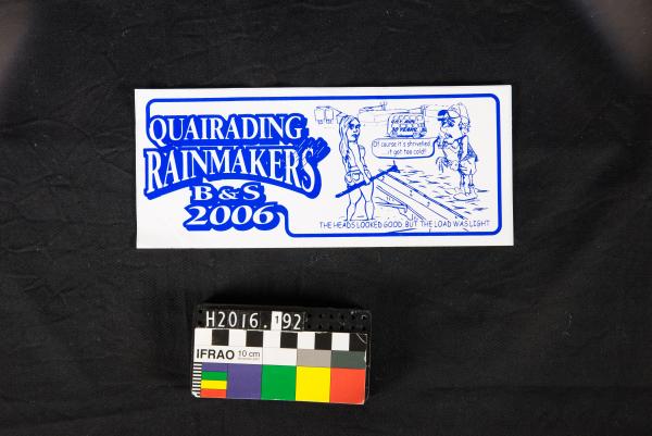 STICKER, blue & white, 'QUAIRADING RAINMAKERS B&S 2006', cartoon of woman and man