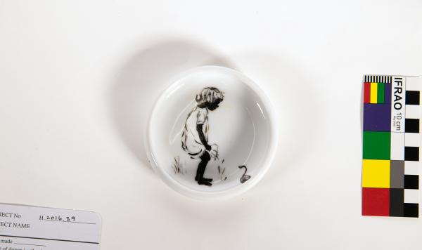 DISH, small round white, handpainted with black figure of child by Bobbie Munt