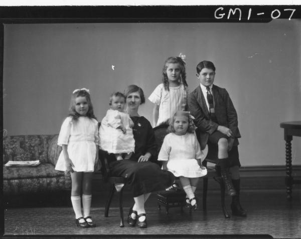 Family portrait woman and five children, F/L, Mrs. 'Ogg'.