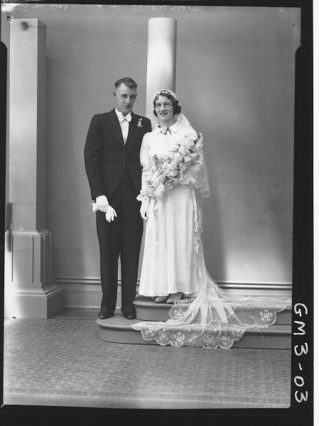 Portrait of bride and groom, F/L, 'Jackson'. Including studio column props.