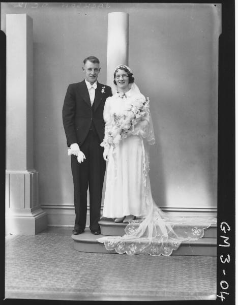 Portrait of bride and groom, F/L, 'Jackson'. Including studio column props.