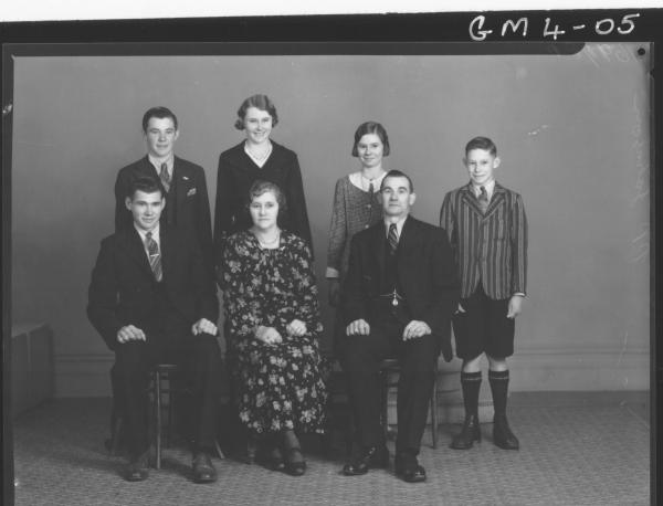 Portrait of family group man, woman and five children , F/L Johnson.